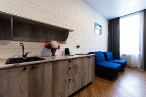 Luxury-Apartment | Wohnbereich | Flachbildfernseher, Fußbodenheizung