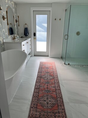 Shower, hair dryer, towels, toilet paper