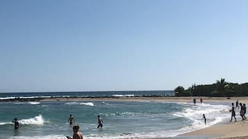 On the beach, sun loungers, beach towels