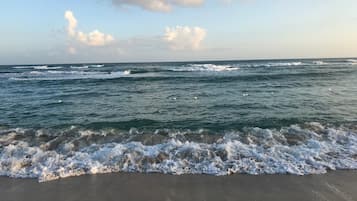 On the beach, sun loungers, beach towels