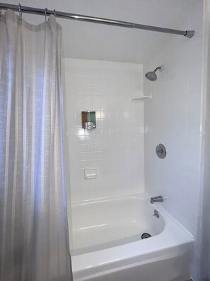 Combined shower/tub, hair dryer, towels, soap