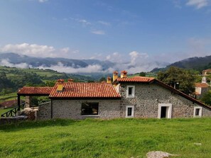 Set amidst lush green hills, this charming building offers a serene atmosphere and a tranquil escape.