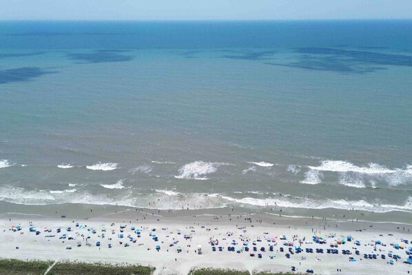 On the beach, sun-loungers, beach towels