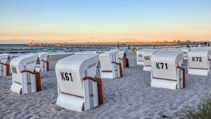 Beach chairs labeled K61, K62, K63, K64, K65, K66, K67, K68, K69, K70, K71, K72, K73, K74, K75, K76, K77, K78, K79, K80, K81, K82, K83, K84, K85, K86, K87, K88, K89, K90, K91, K92, K93, K94, K95, K96, K97, K98, K99, K100, K101, K102, K103, K104, K105, K106, K107, K108, K109, K110, K111, K112, K113, K114, K115, K116, K117, K118, K119, K120, K121, K122, K123, K124, K125