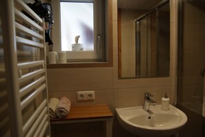 Shower, hair dryer, towels, soap