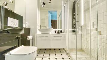 Shower, hair dryer, slippers, towels