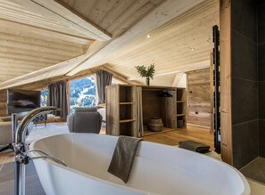 Combined shower/tub, hair dryer, towels, soap