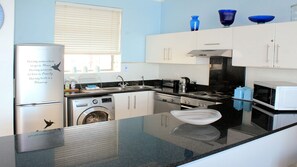 Surfers Penthouse | Private kitchen | Full-size fridge, microwave, oven, stovetop
