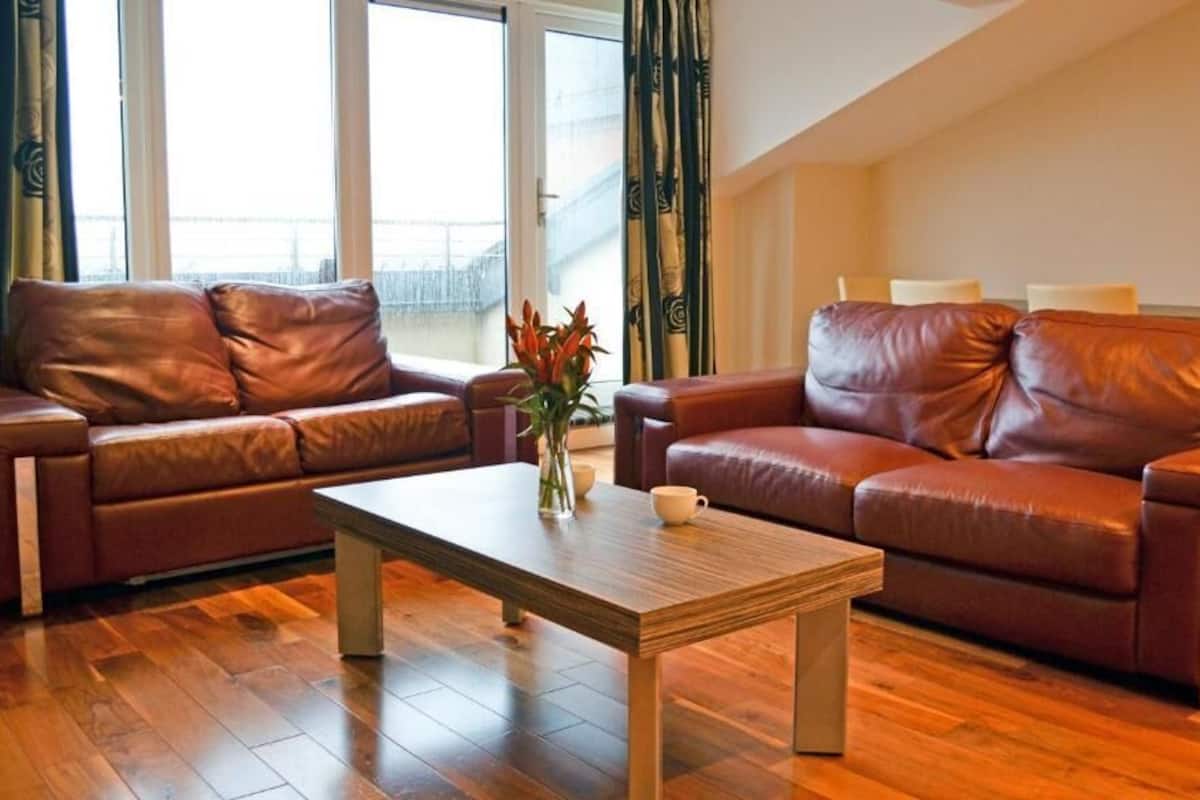 Two-Bedroom Apartment (5 Adults) | Living room | Flat-screen TV