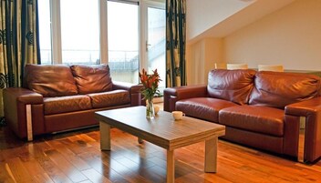 Two-Bedroom Apartment (5 Adults) | Living room | Flat-screen TV