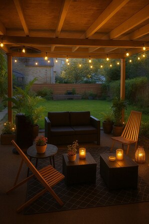 An outdoor patio area with a wooden bench, a sofa, and a table, all under a wooden pergola. - TY SAM (3CH) - NEW, MODERN HOUSE NEAR BEACHES AND AMENITIES (Trébeurden)