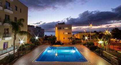 Coastal apartment with terrace and pool