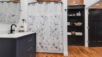 Combined shower/bathtub, hair dryer, towels, soap
