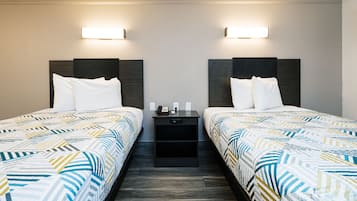 Premium bedding, desk, laptop workspace, blackout drapes