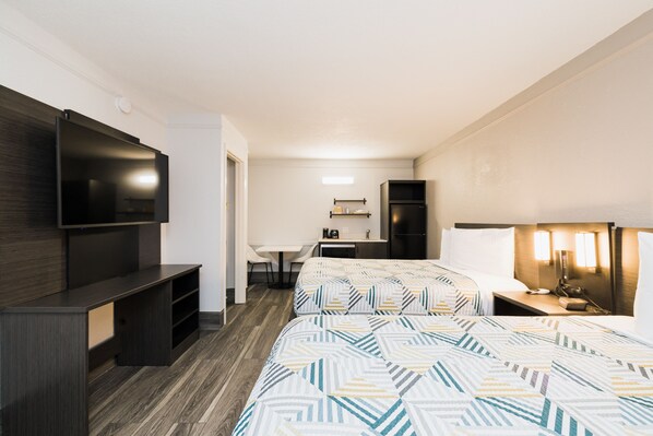 Premium bedding, desk, laptop workspace, blackout curtains