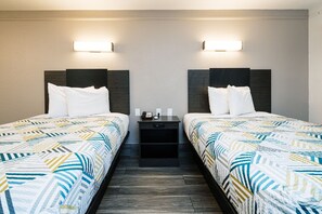 Premium bedding, desk, laptop workspace, blackout drapes - Studio 6 Baytown, TX - Garth Road (Baytown)