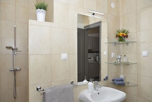 Bathtub, hair dryer, towels, soap