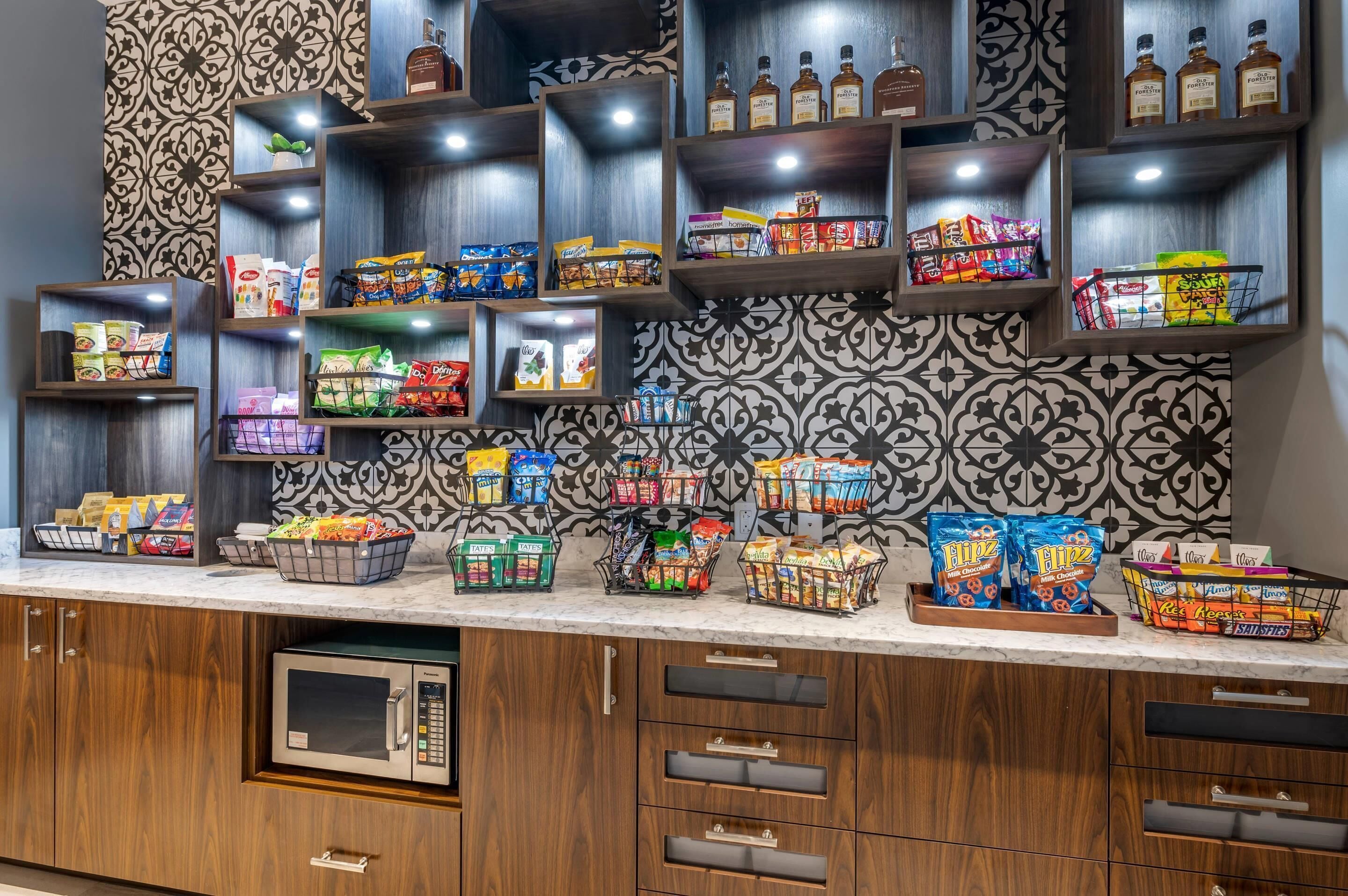 A snack bar with various packaged snacks and beverages.