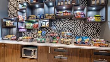 A snack bar with various packaged snacks and beverages.