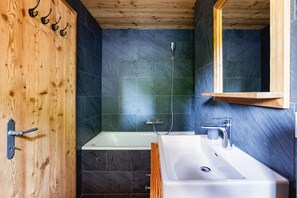 Bathtub, hair dryer, towels