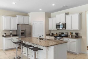 Coffee/tea maker, fridge, microwave, oven
