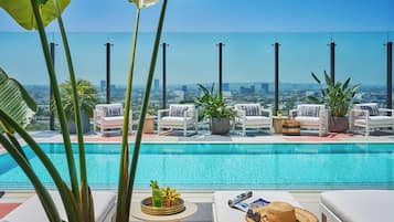 Outdoor pool, open 7:00 AM to 7:00 PM, pool umbrellas, pool loungers