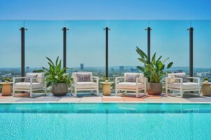 Outdoor pool, open 7:00 AM to 7:00 PM, pool umbrellas, pool loungers