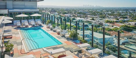 Outdoor pool, open 7:00 AM to 7:00 PM, pool umbrellas, sun loungers