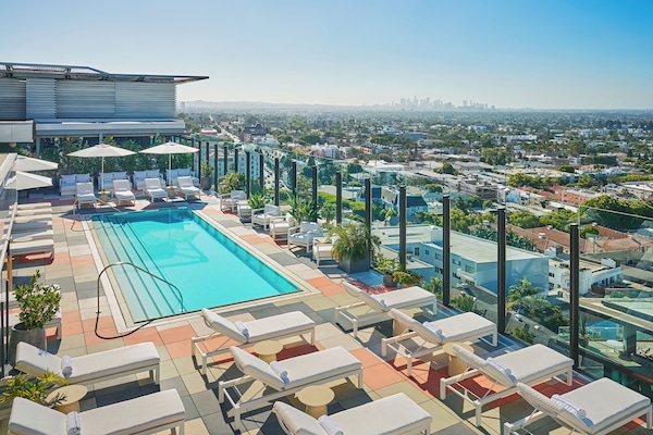 Outdoor pool, open 7:00 AM to 7:00 PM, pool umbrellas, sun loungers