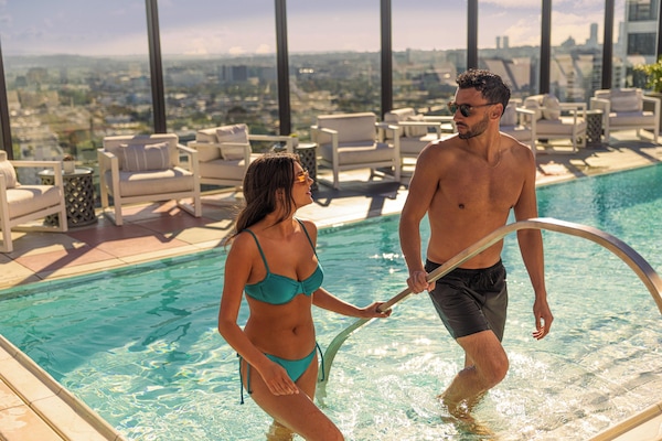 Outdoor pool, open 7:00 AM to 7:00 PM, pool umbrellas, sun loungers
