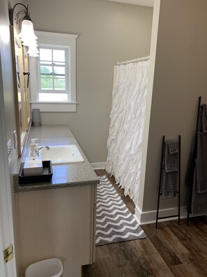 Combined shower/tub, hair dryer, towels, soap