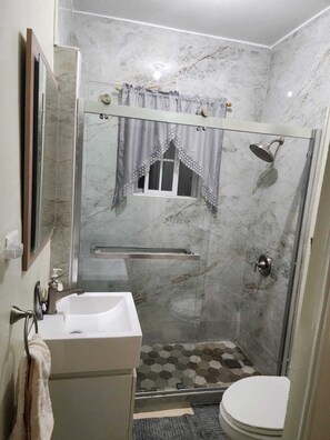 Bathtub, hair dryer, towels, soap