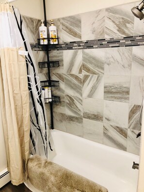 Combined shower/tub, hair dryer, towels, soap
