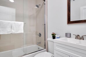 Combined shower/tub, hair dryer, towels, soap