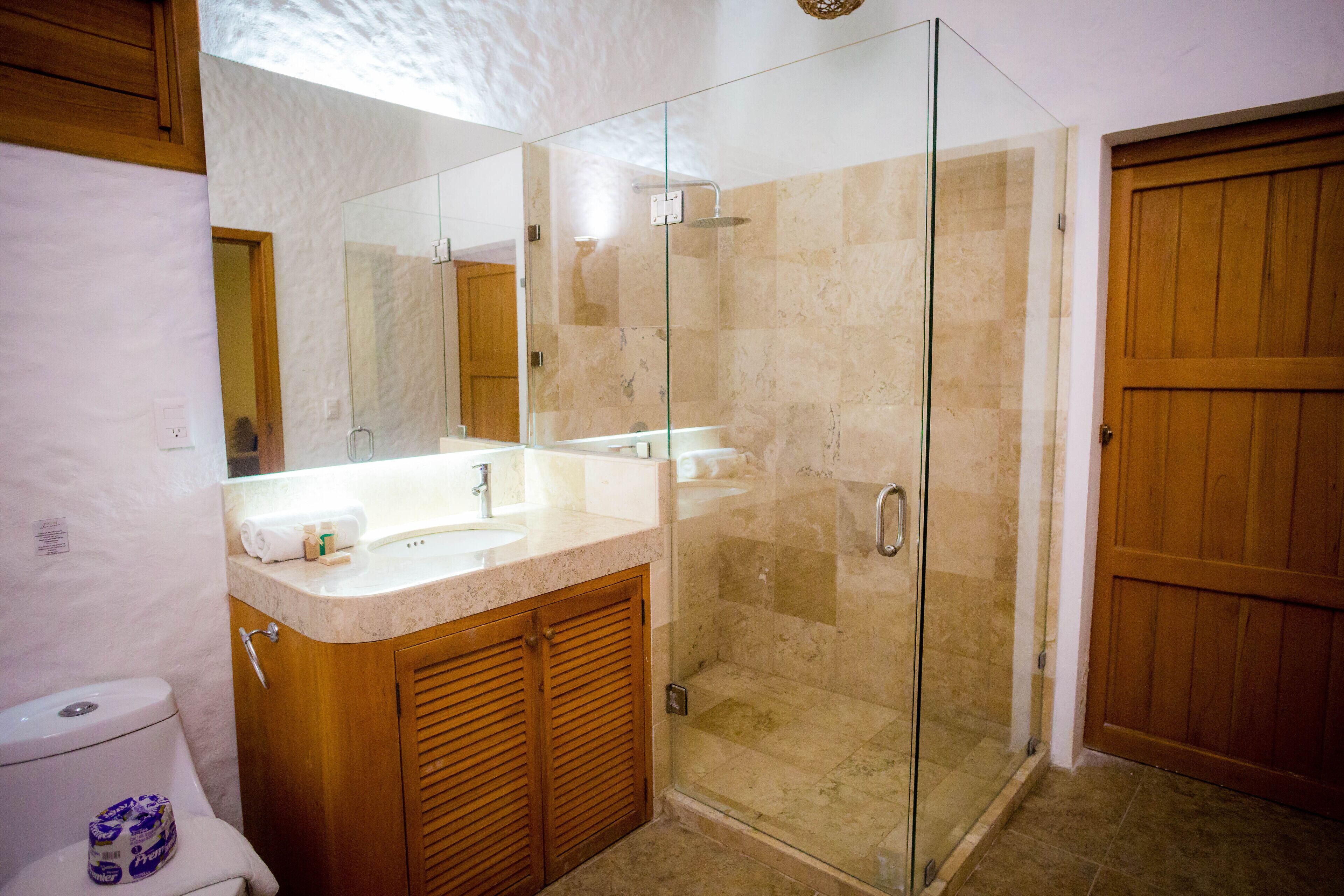 family room | bathroom | shower, rainfall showerhead, free toiletries, towels