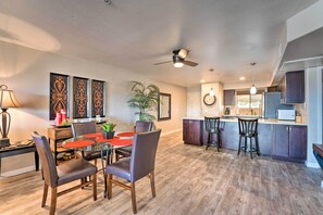 Enjoy cooking in this well-equipped kitchen with a central island, microwave, and sink, perfect for meal prep and socializing.