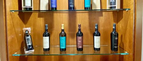 A wine display case with various bottles and boxes.