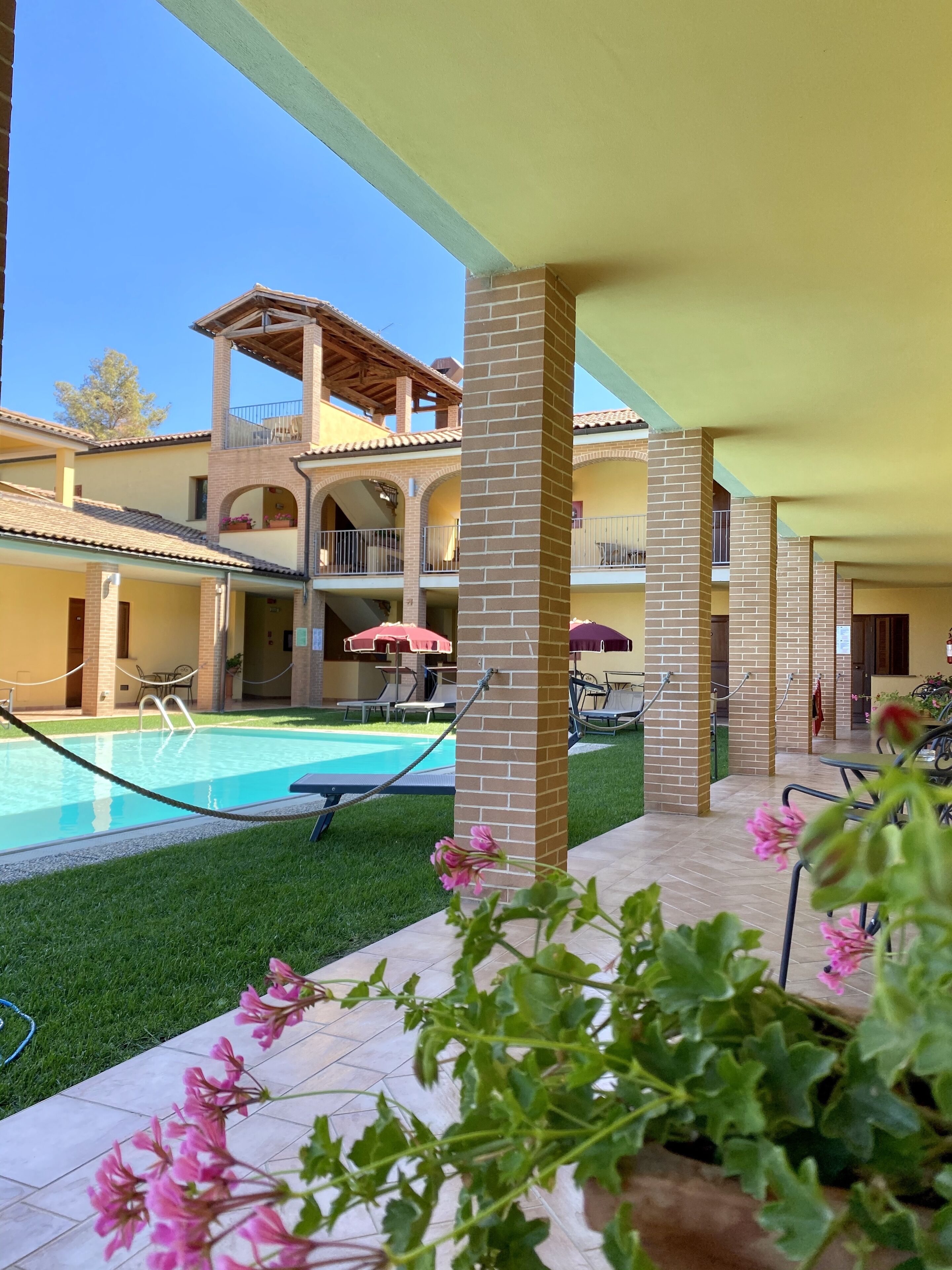 seasonal outdoor pool, open 9:30 am to 7:30 pm, pool umbrellas