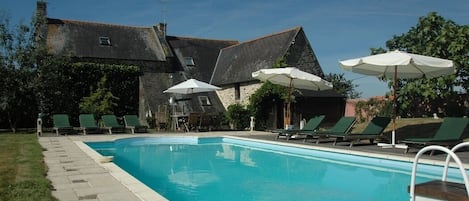 Outdoor pool, a heated pool, pool loungers