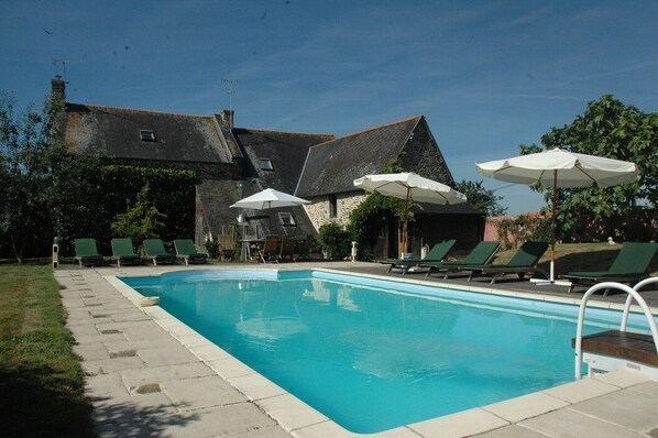 Outdoor pool, a heated pool, sun loungers