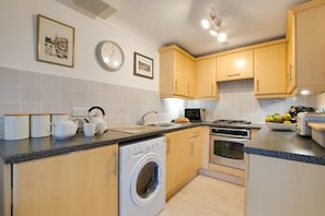 Fridge, microwave, oven, cookware/dishes/utensils