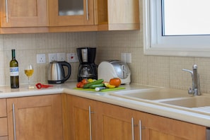 Microwave, oven, stovetop, dining tables
