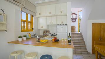 Microwave, oven, stovetop, dining tables