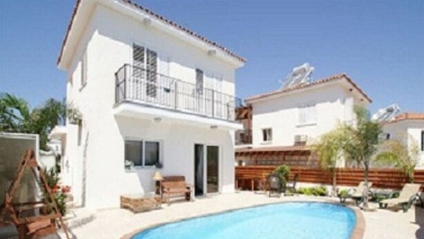 A two-story building with a swimming pool, outdoor seating, and a wooden deck. - Your Beautiful Holiday Villa Minutes From the Beach, Protaras Villa 1489 (Paralimni)