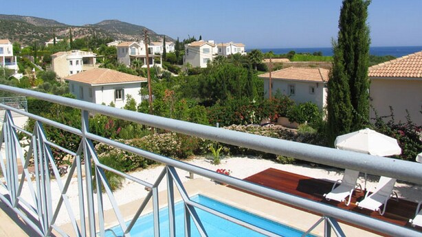 A residential area with houses, a swimming pool, and a view of the sea. - How to Rent Your Own Villa in Paphos With Fantastic Private Pool, Paphos Villa 1418 (Neo Chorio)