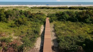 A wooden boardwalk leading to a beach with a clear view of the ocean. - Oceanfront / Sleeps 16 / Beach Days / Screen Porch (Isle of Palms)