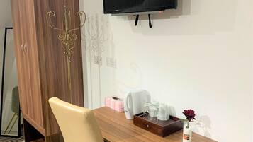 32-inch flat-screen TV with cable channels, TV