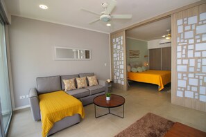 Deluxe Apartment, 1 Bedroom | Living area | 40-inch flat-screen TV with cable channels, TV