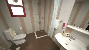 A bathroom with a toilet, shower, and sink. - Downtown Hotel (Dubai)