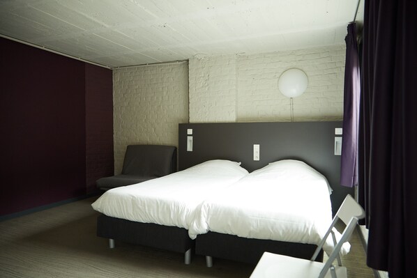 Premium bedding, blackout curtains, iron/ironing board, free WiFi